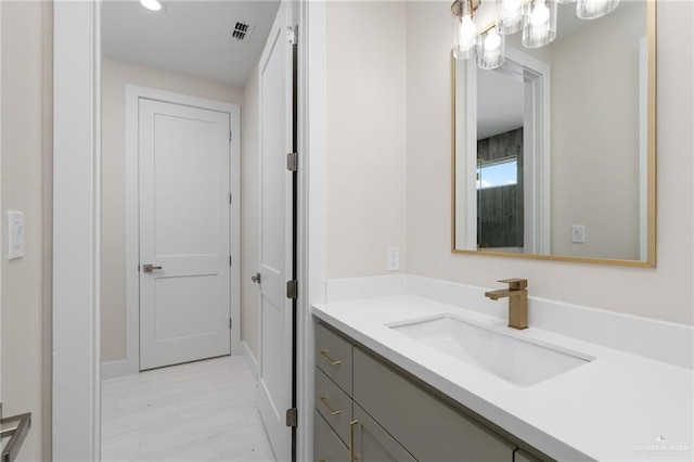 17956 Garrett Rd, Harlingen, TX 78552 - bathroom featuring vanity, a chandelier, and recessed lighting