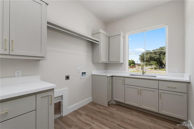 17956 Garrett Rd, Harlingen, TX 78552 - laundry area with hookup for an electric dryer, washer hookup, and light wood finished floors