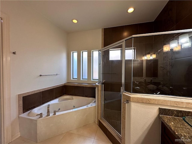 bathroom featuring separate shower and tub, tile patterned flooring, and vanity