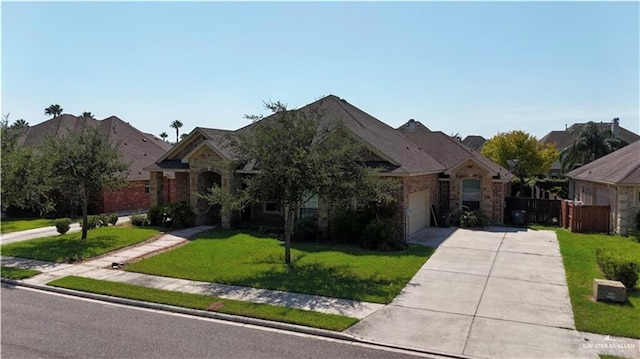 view of front of home with a front yard and a garage