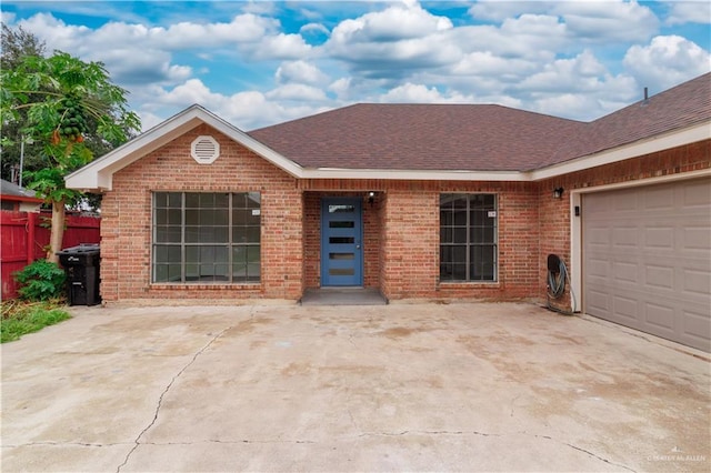 ranch-style home featuring a garage