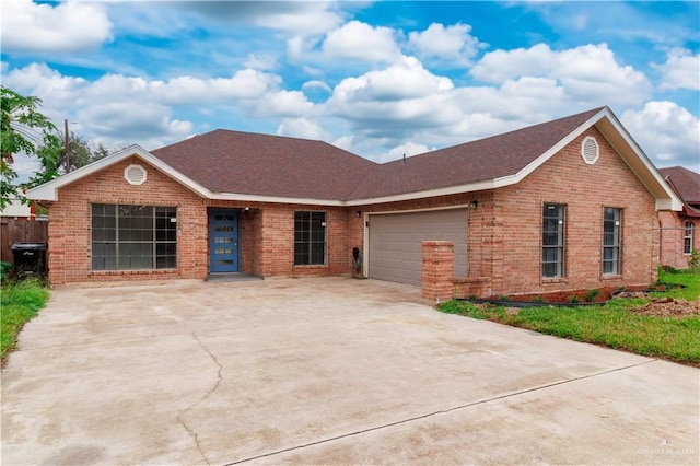 single story home featuring a garage