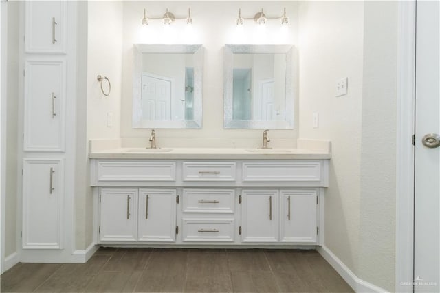 bathroom featuring vanity and hardwood / wood-style flooring