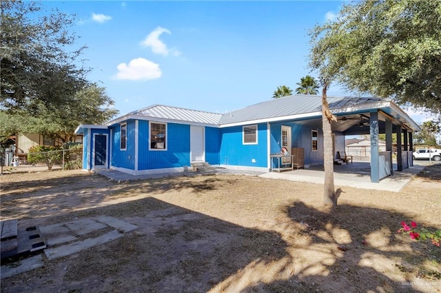 rear view of property with a patio