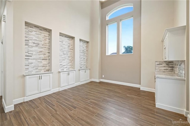 1518 Tierra Bella, Weslaco, TX 78596 - entrance foyer with wood finished floors, baseboards, and a high ceiling