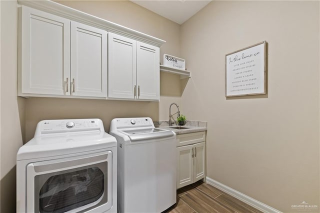 1518 Tierra Bella, Weslaco, TX 78596 - laundry room featuring washer and clothes dryer, cabinet space, dark wood-style floors, and baseboards