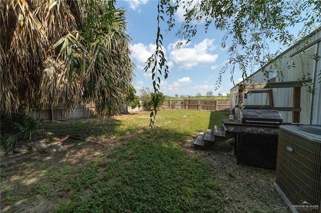 view of yard with central AC unit