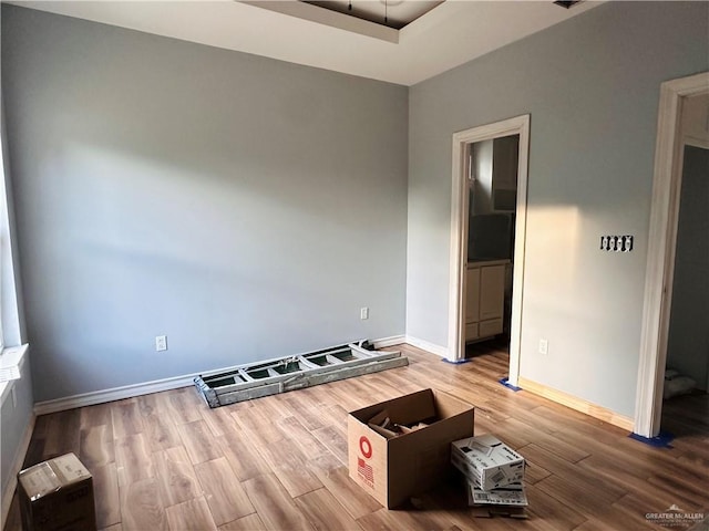 unfurnished room with wood-type flooring