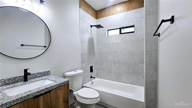 full bathroom featuring tiled shower / bath combo, toilet, and vanity