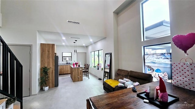 living room with a towering ceiling