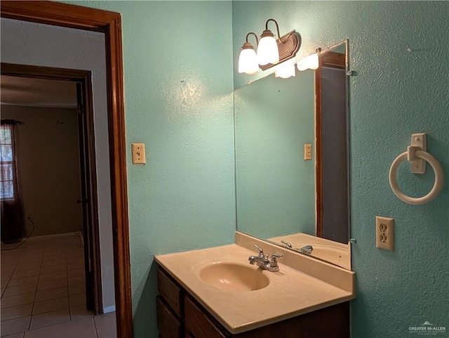 605 8th St, Hidalgo, TX 78557 - bathroom with tile patterned flooring and vanity
