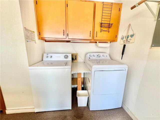 laundry room with cabinets and washer and dryer