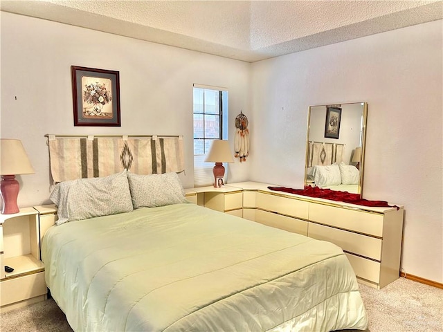 carpeted bedroom with a textured ceiling