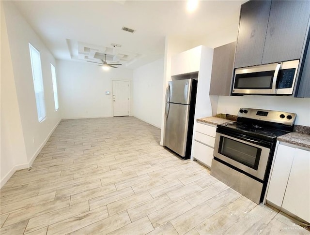 kitchen featuring white cabinetry, ceiling fan, light hardwood / wood-style flooring, and appliances with stainless steel finishes