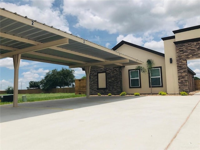 exterior space with a carport