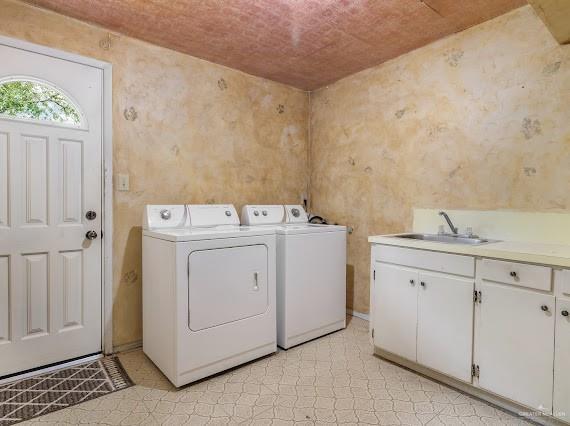 131 N Missouri Ave, Mercedes, TX 78570 - laundry room with a sink, cabinet space, and independent washer and dryer