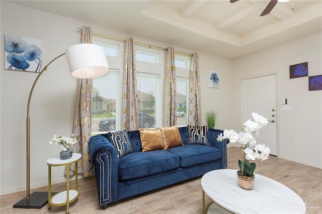 living room with beam ceiling, hardwood / wood-style floors, and ceiling fan