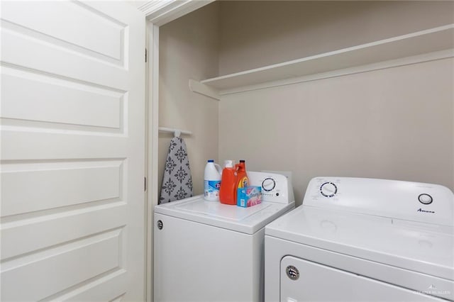 laundry area with washing machine and dryer