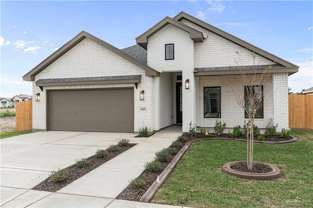 view of front facade with a front lawn and a garage