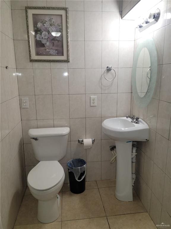 3300 Pradera St, Mission, TX 78574 - half bathroom featuring tile patterned floors, tile walls, and toilet