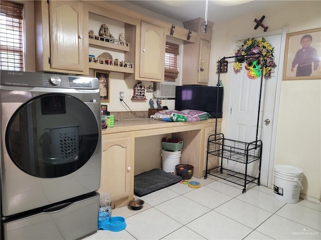 3300 Pradera St, Mission, TX 78574 - laundry area with washer / dryer, cabinet space, light tile patterned floors, and plenty of natural light
