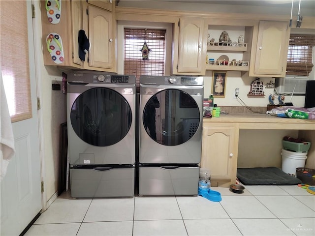 3300 Pradera St, Mission, TX 78574 - laundry area featuring washing machine and dryer, cabinet space, light tile patterned floors, and cooling unit
