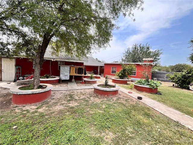 3300 Pradera St, Mission, TX 78574 - back of house featuring a lawn
