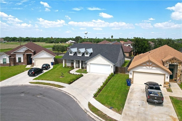 16593 W Mccullar Ct, Harlingen, TX 78552 - view of front of home with concrete driveway, stone siding, and a residential view