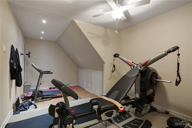 exercise area featuring vaulted ceiling and ceiling fan