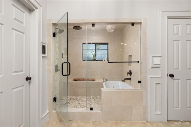 bathroom featuring plus walk in shower