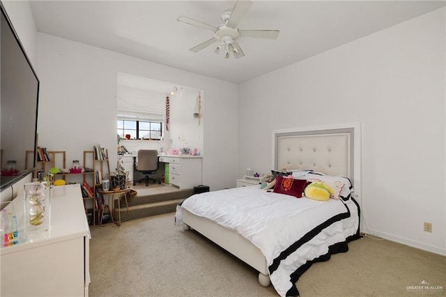 bedroom with light carpet and ceiling fan