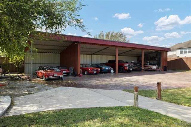 view of vehicle parking featuring a carport