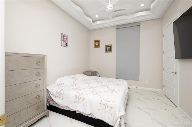 bedroom featuring baseboards, marble finish floor, a ceiling fan, recessed lighting, and a tray ceiling