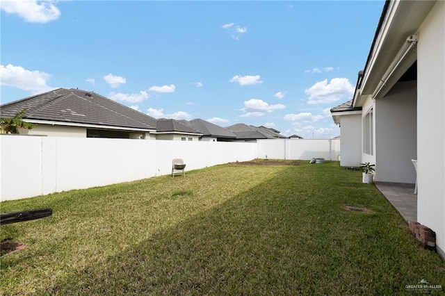 view of yard featuring a fenced backyard