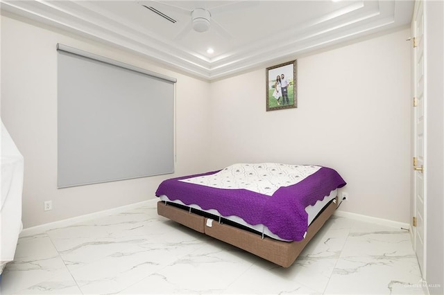 bedroom with baseboards, recessed lighting, marble finish floor, and a raised ceiling