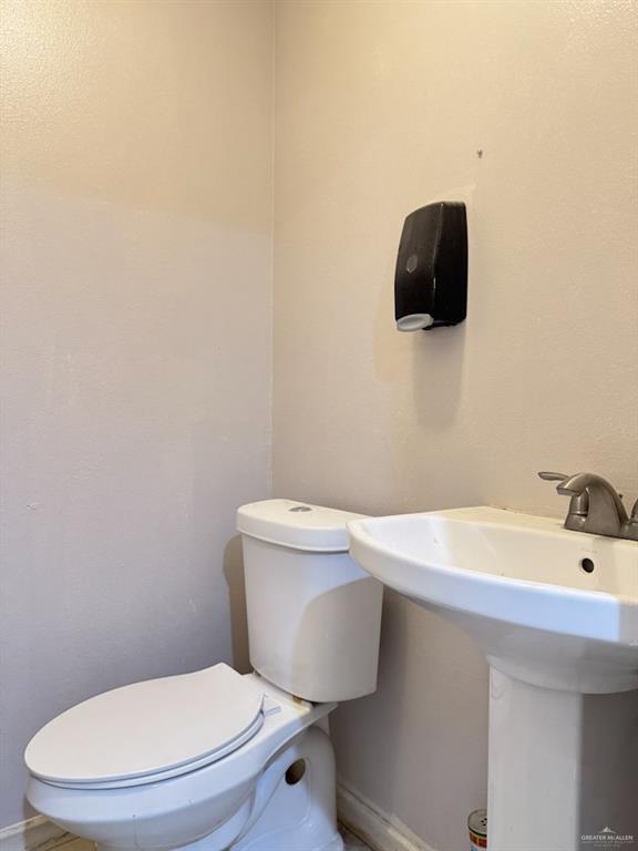 bathroom featuring sink and toilet