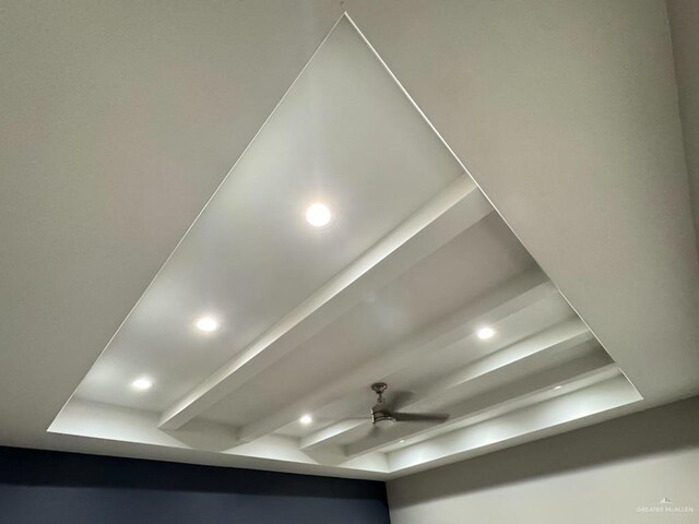 details featuring beamed ceiling and ceiling fan