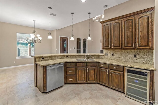 kitchen featuring sink, hanging light fixtures, beverage cooler, stainless steel dishwasher, and backsplash