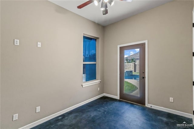 doorway to outside featuring ceiling fan