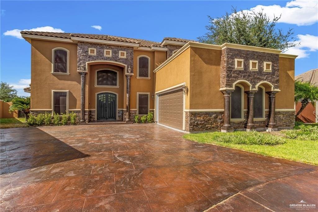 mediterranean / spanish-style house featuring a garage