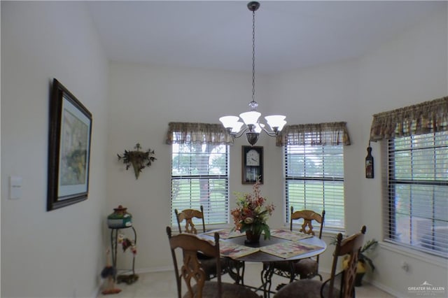 3319 Country Club Dr N, Edinburg, TX 78542 - dining space with a chandelier, plenty of natural light, and baseboards