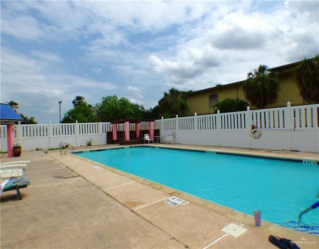 3319 Country Club Dr N, Edinburg, TX 78542 - community pool featuring fence and a patio