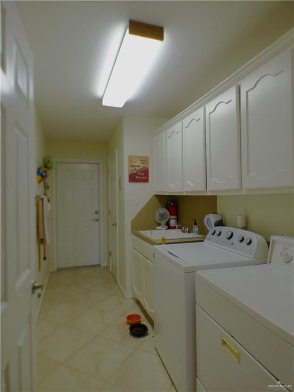 3319 Country Club Dr N, Edinburg, TX 78542 - laundry room with cabinet space, separate washer and dryer, light tile patterned floors, and baseboards