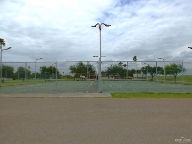3319 Country Club Dr N, Edinburg, TX 78542 - view of tennis court featuring fence