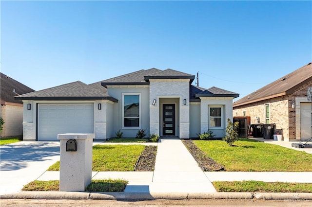 view of front of house with a garage and a front lawn