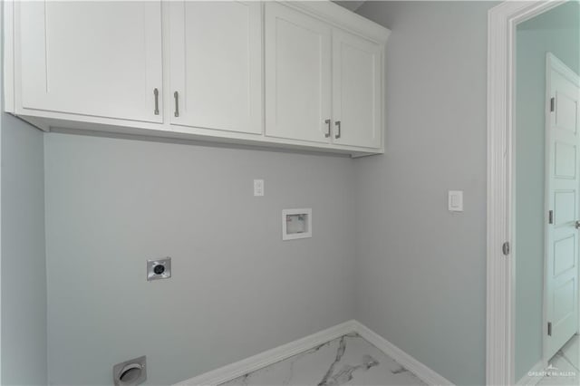 laundry room featuring electric dryer hookup, cabinets, and washer hookup