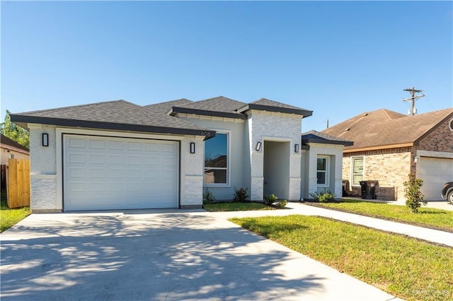 view of front facade featuring a front lawn and a garage