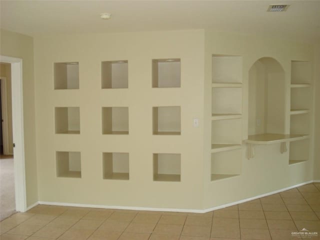 719 W Sherryl Ave, Pharr, TX 78577 - empty room featuring built in features, tile patterned flooring, a smoke detector, and baseboards