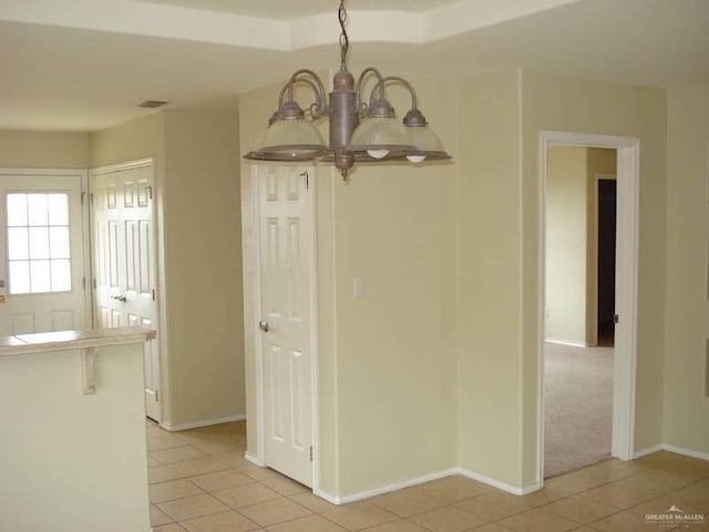 719 W Sherryl Ave, Pharr, TX 78577 - unfurnished dining area with a chandelier, light tile patterned floors, and baseboards