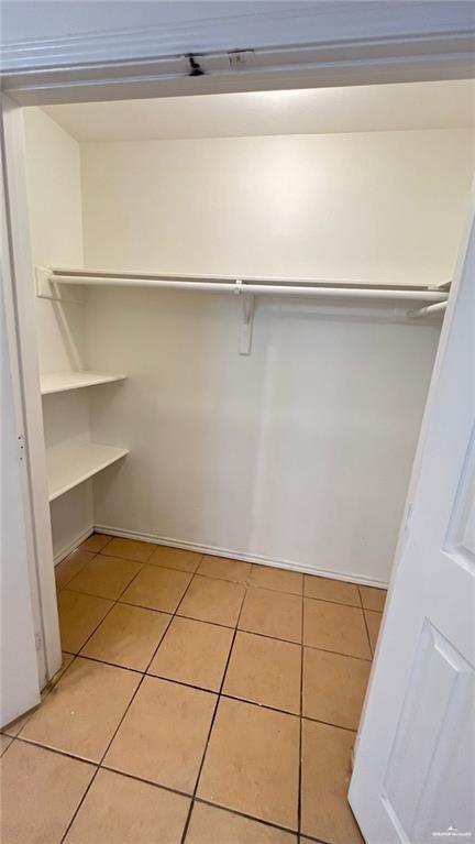 walk in closet featuring light tile patterned floors